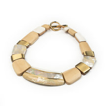 Load image into Gallery viewer, Necklace of different shaped white wooden segments inlaid with mother of pearl and abalone shell and brass