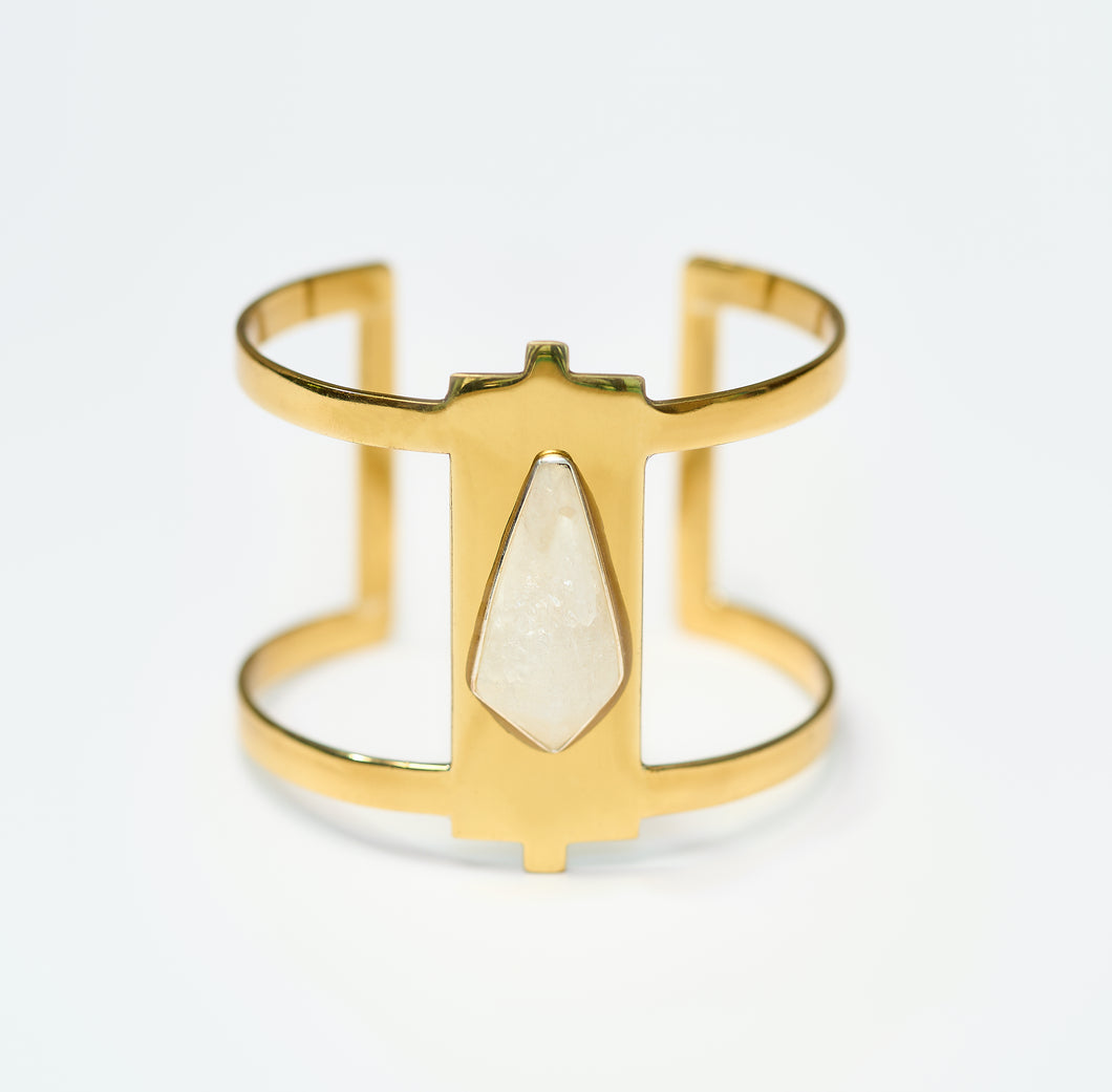 Gold Cuff bracelet inlaid with crystal on white background