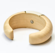Load image into Gallery viewer, Wooden Cuff bracelet  with a central mother of pearl inlay on a white background
