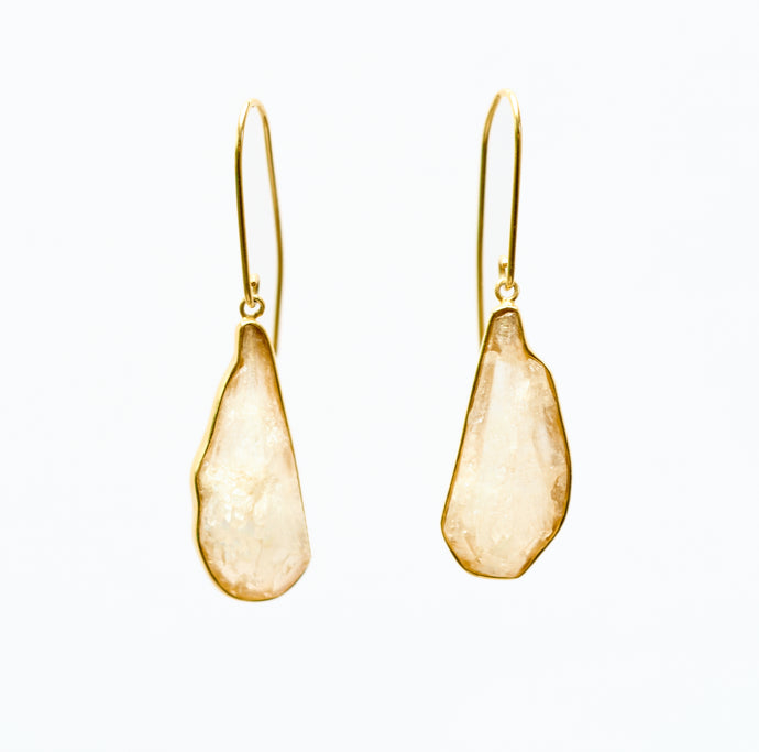 Rock Crystal and 18k gold plated silver pendant earrings on white background