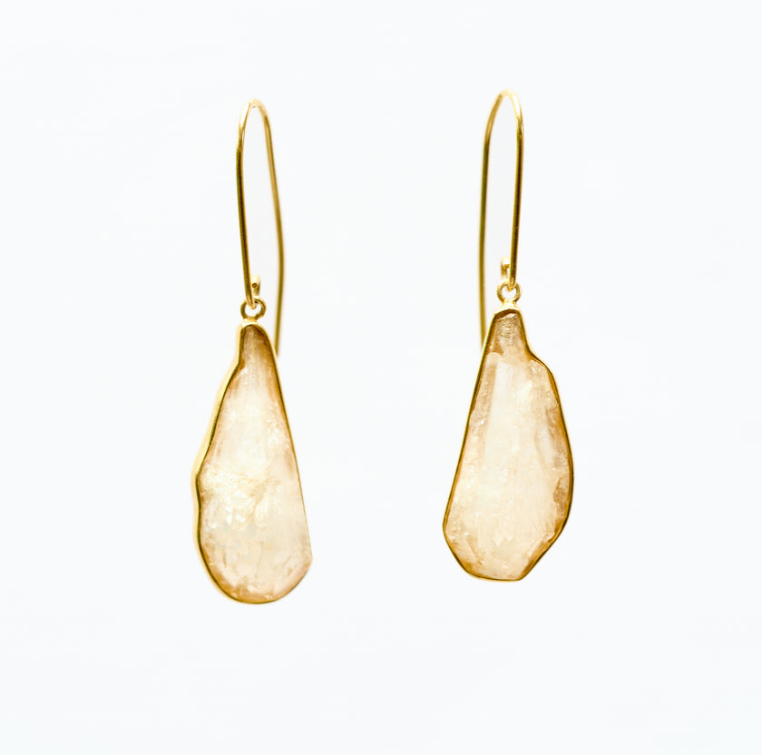 Rock Crystal and 18k gold plated silver pendant earrings on white background