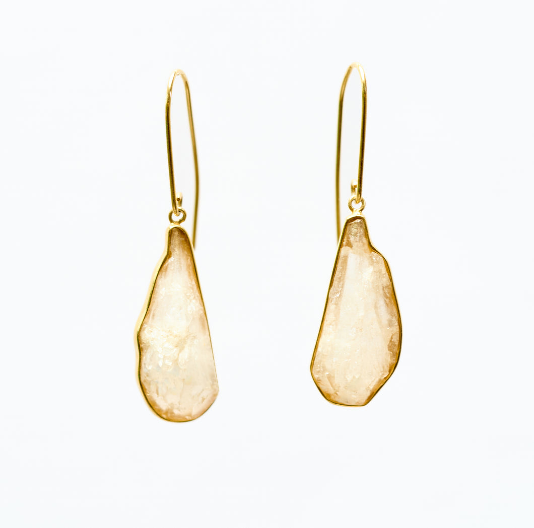 Rock Crystal and 18k gold plated silver pendant earrings on white background