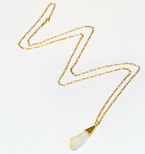 Load image into Gallery viewer, Gold chain necklace with a raw rock crystal pendant on a white background
